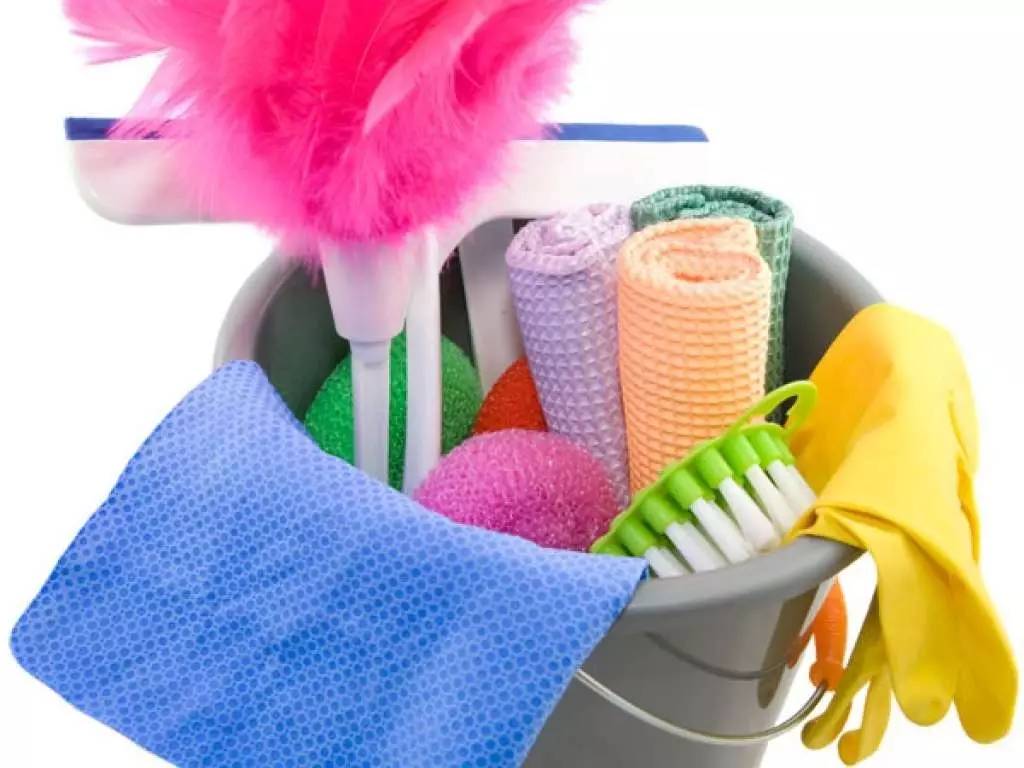 a mop bucket with various cleaning supplies