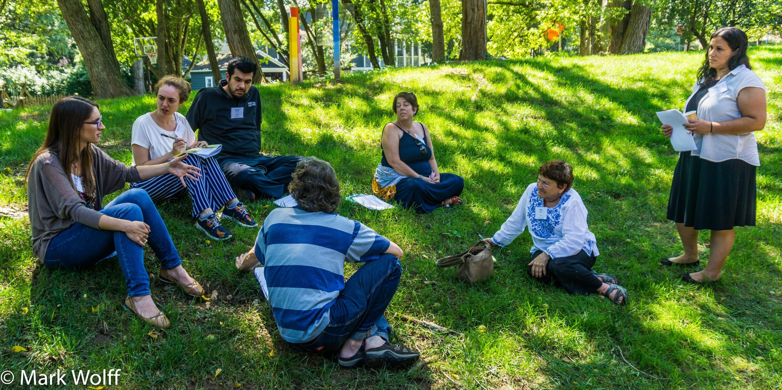 Planning meeting outside on grass