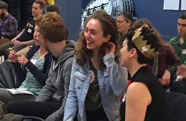 people chat at annual community meeting