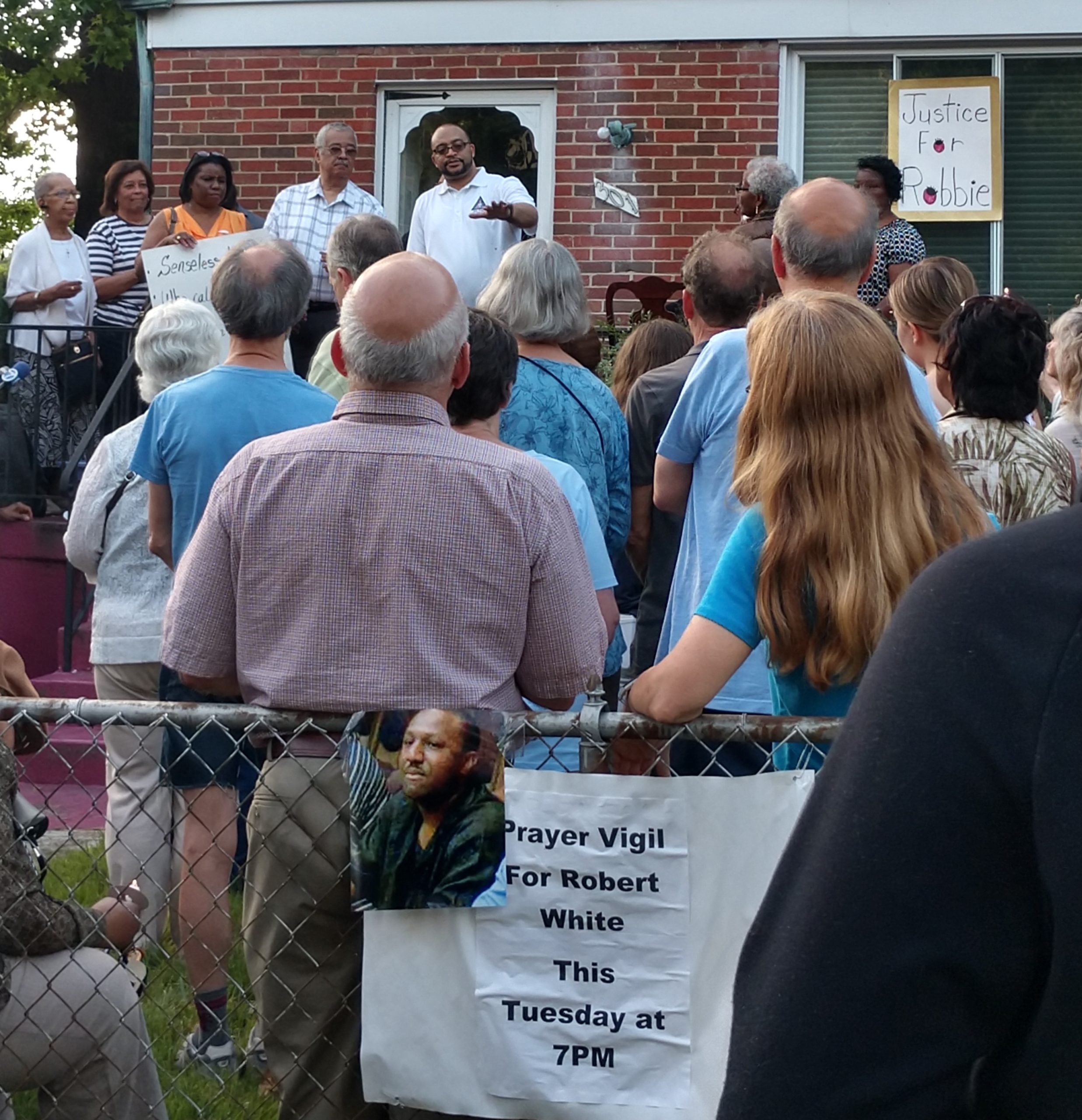 A group of people gathered for the Robert White vigil