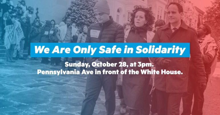 activists with the text we are only afe in solidarity super imposed