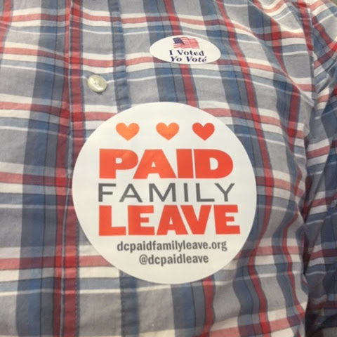 photo of someone wearing a paid family leave sticker