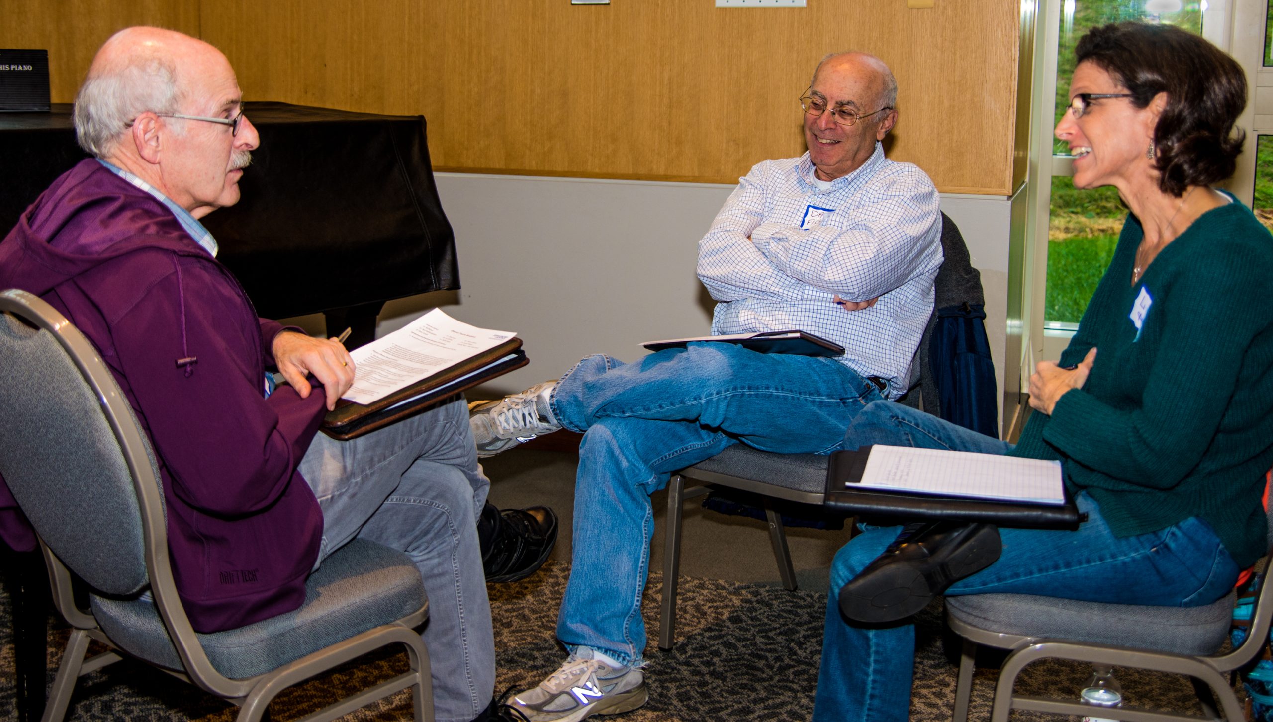 3 people sitting and talking