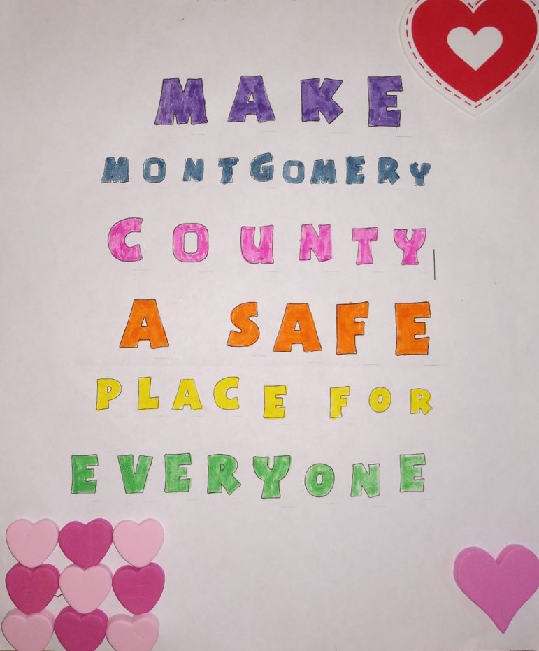 a hand drawn sign reading make montgomery county a safe place for everyone