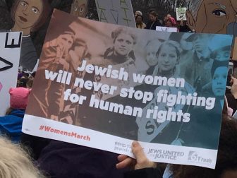 a sign reading jewish women will never stop fighting for human rights