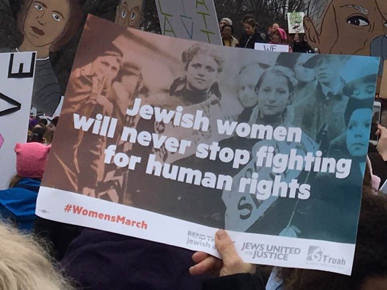 a sign reading jewish women will never stop fighting for human rights