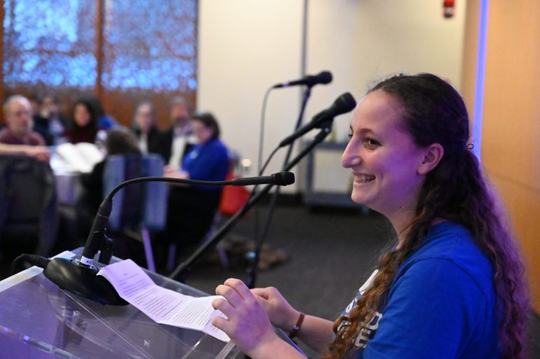 woman smiling at podium