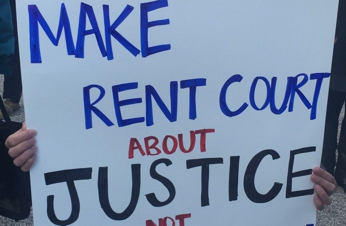sign reading make rent court about justice