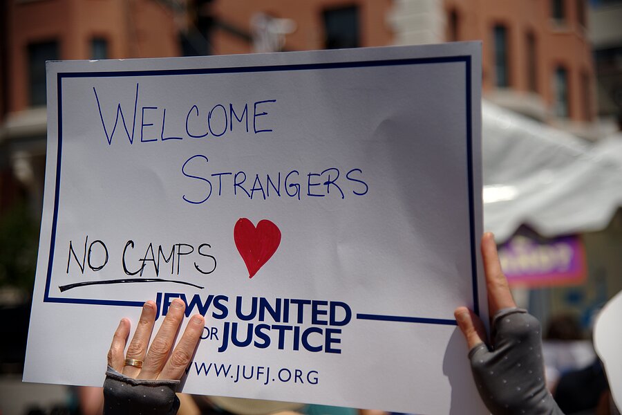 sign reading welcome strangers no camps