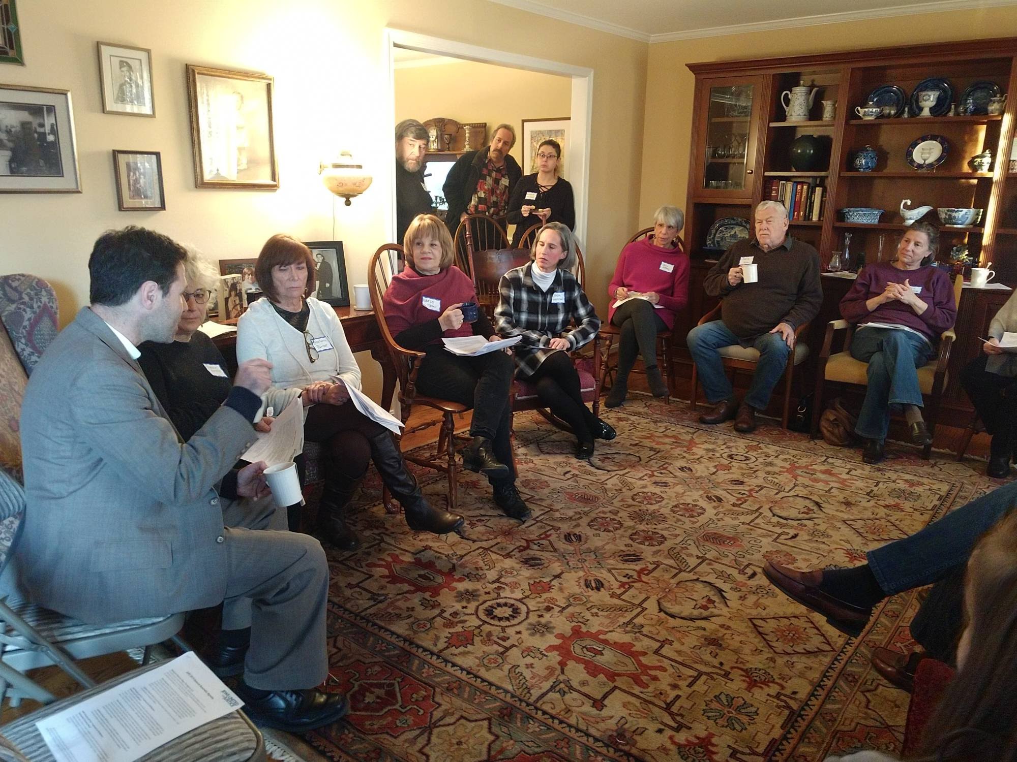 district 14 legislator meeting, people in a circle in a cozy home