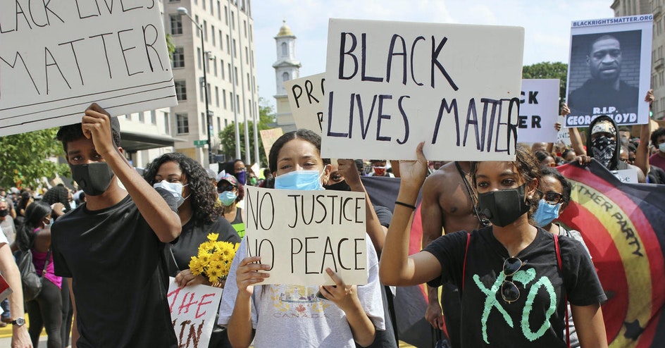 People holding Black Lives Matter signs