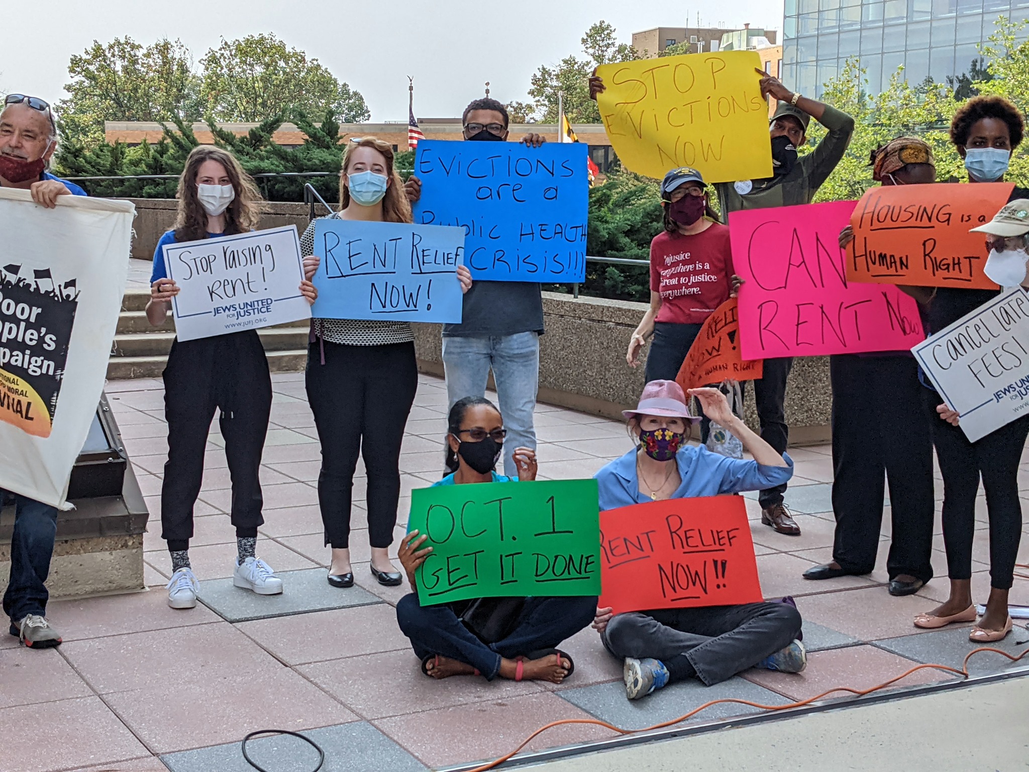 Photo of JUFJ staff and partners in the Montgomery County Racial Equity Network at a rally for emergency rent relief.