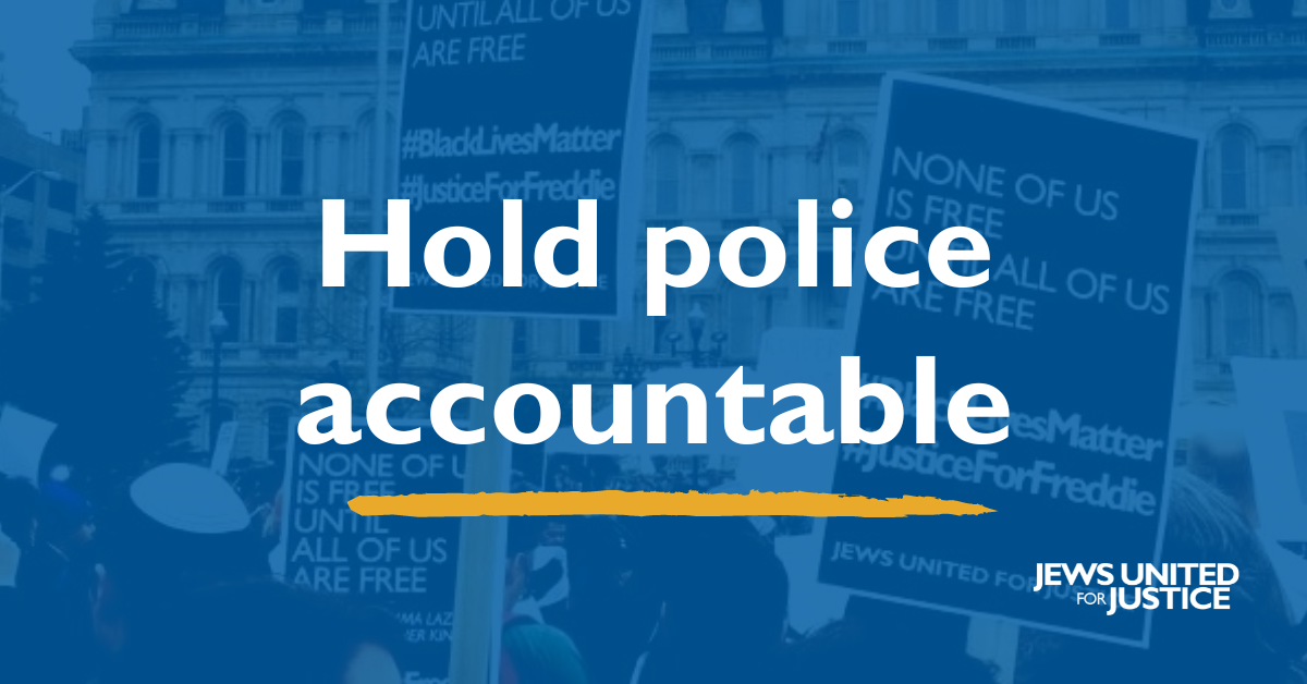 Protestors at a rally after the murder of Freddie Gray with text: "Hold police accountable"
