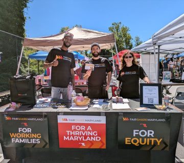 JUFJ staff and partners tabling for economic justice!