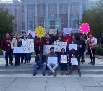 JUFJers and partners holding up signs for housing justice outside of the MD state house